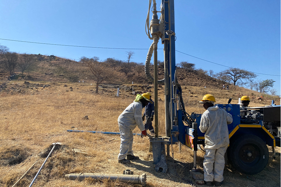 Borehole drilling crew preparing site in Gauteng